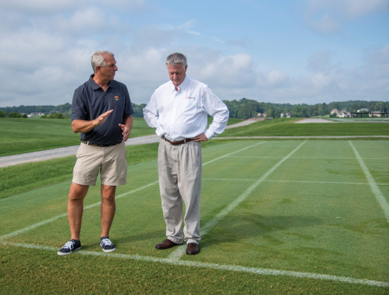 UTIA's John Sorochan and John Stier standing beside turfgrass research plot