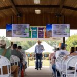 Presenter inside pavilion at 2024 Steak and Potatoes Field Day