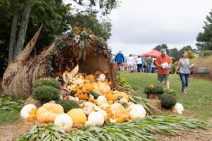 Visitors near plant display at 2023 Fall Gardeners Festival in Crossville.
