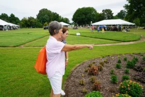 Participants in the 2023 Summer Celebration admiring the gardens