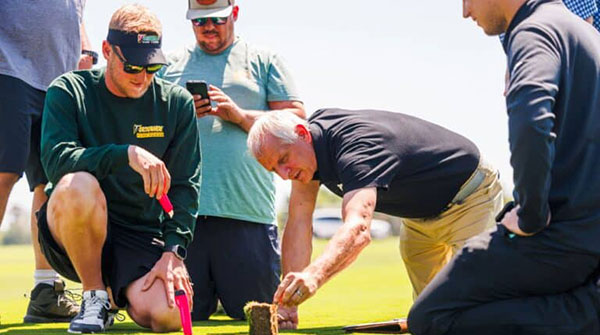 John Sorochan works with others looking at turfgrass